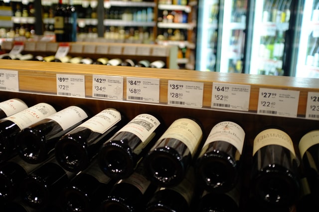 wine bottles with prices in a bottle shop store