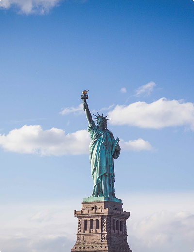<span>Virtual cards</span> for online and in-store use The Statue of Liberty stands on its pedestal against a blue sky with scattered clouds, symbolizing freedom and welcoming visitors to the USA.