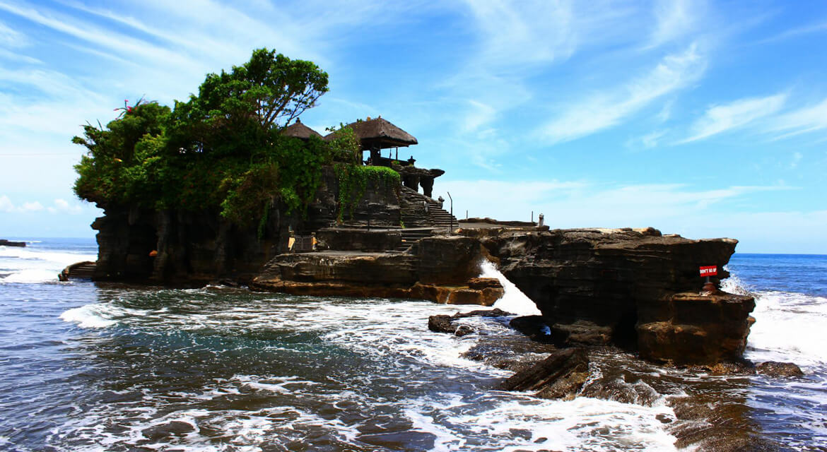 Tanah Lot sea temple in Bali, Indonesia—ancient Hindu pilgrimage site with dramatic ocean views and cultural significance.