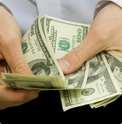 Counting Cash U.S. Dollars in Hand Exchange AUD to IDR
