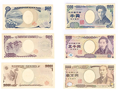 Japanese yen banknotes showing various denominations and portraits arranged to highlight currency design and acceptance across Japan from urban centers to rural markets